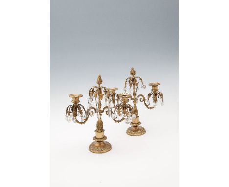 A PAIR OF BRASS LUSTRE THREE LIGHT CANDELABRA