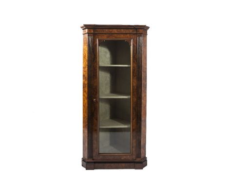 A VICTORIAN WALNUT CORNER CABINET, by Marsh, Jones and Cribb, the step moulded cornice above a single glazed door and flankin