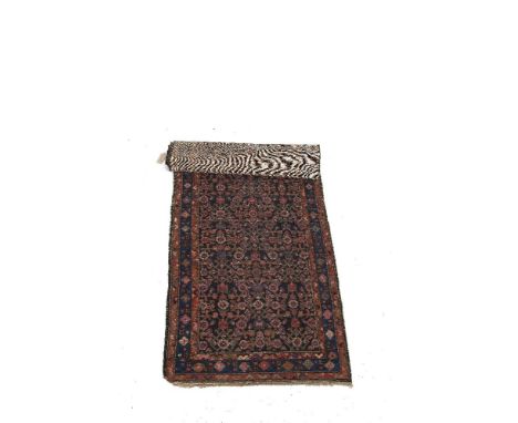 A PERSIAN RUNNER, with navy ground and geometric motifs.