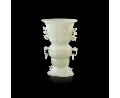 CELADON JADE GU-FORM VASEREPUBLIC PERIOD the trumpet neck carved on each side with a pair of confronting dragons, above a ruy