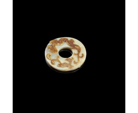 CELADON AND RUSSET JADE 'CHILONG' DISCthe small bi disc carved in mid-relief incorporating the russet skin with a chilong and