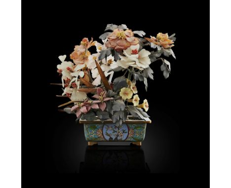 HARDSTONE TREE IN A CLOISONNÉ ENAMEL JARDINIÈREMID-20TH CENTURY the gnarled tree with green hardstone leaves adorning twistin