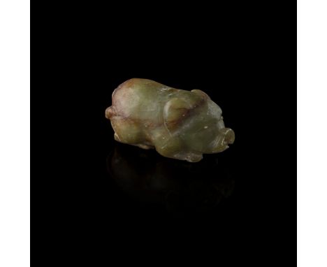 GREEN AND RUSSET JADE PENDANT IN THE SHAPE OF A PIGMING DYNASTY the recumbent animal with its head resting on its front legs,