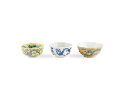 ASSEMBLED GROUP OF THREE PORCELAIN 'DRAGON' BOWLScomprising: a blue and white bowl; a green-enamel café-au-lait ground bowl, 
