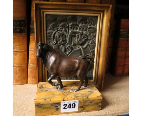 After Giovan Susani - a bronzed figure of a bull on a marble base, together with a framed bronze plaque of Christ and his dis