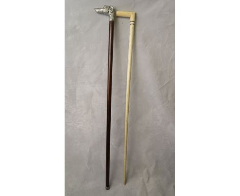 A mid 20th century marine ivory and whale bone walking stick with applied silver plated plaque bearing the engraved initials 
