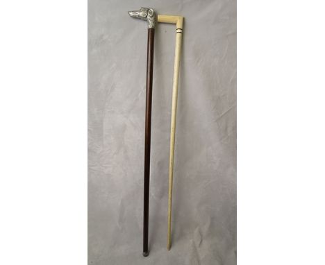 A mid 20th century marine ivory and whale bone walking stick with applied silver plated plaque bearing the engraved initials 