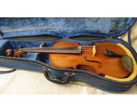 An early 20th century viola with label to interior, reading 'Copy of Antonius Stradivarius', in a blue cloth case