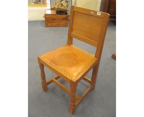 A light oak Thomas Mouseman hall chair having tan leather upholstered back and seat on turned legs with square stretchers