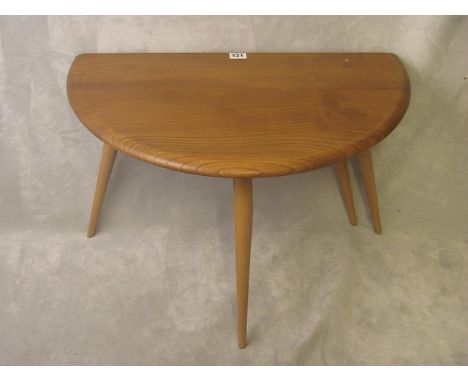 A small Ercol drop leaf coffee table, circa 1950, 15 1/2 high