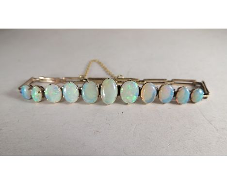 A 9ct gold opal set bracelet