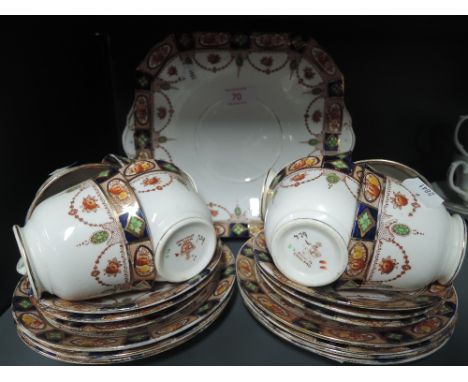 A vintage part tea service in an Imari pattern style