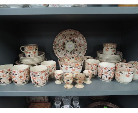 A vintage part dinner service un named in an Imari style