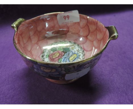 A vintage ceramic footed bowl by Maling in the Peony Rose pattern with lustre glaze