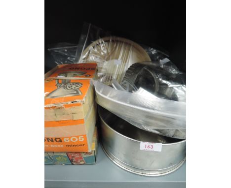 A selection of vintage baking kitchen items and biscuit cutters etc