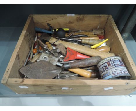 A box of vintage tools including folding rules