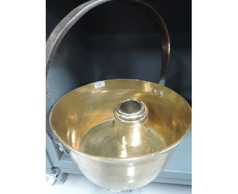 A vintage brass and cast jam pan and ornate eastern style tea caddy