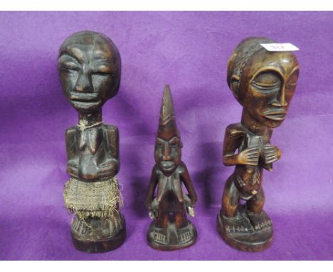 A selection of vintage tribal African carved wooden figures possibly fertility symbols