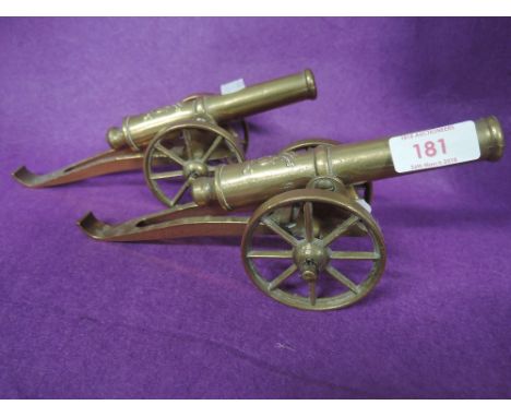 A pair of vintage brass cast cannons 