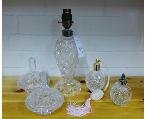 A mixed lot of cut crystal to include a table lamp base, two scent bottles and a pair of powder jar and covers, tallest 28cm,
