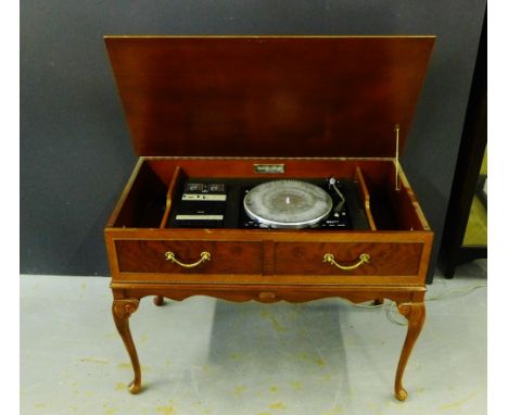 A Garrard vintage record player and tape deck housed within a mahogany case on cabriole supports, 68 x 93cm