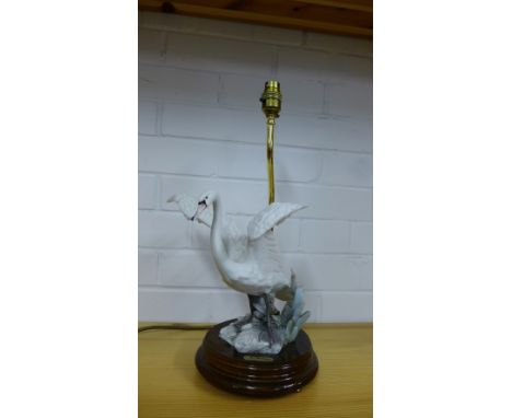 A Capodimonte Swan table lamp, modelled by A. Belcari, on a polished wood base, height excluding light fitting 28cm
