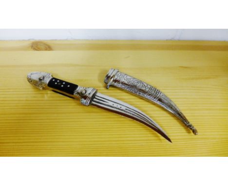 A small Syrian Jambiya with white metal engraved scabbard, 25cm long 