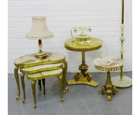 A collection of vintage onyx and brass mounted furniture to include two circular topped tables, a nest of three tables on cab