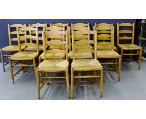 A set of twelve ladder back oak chairs with rush seats (12)