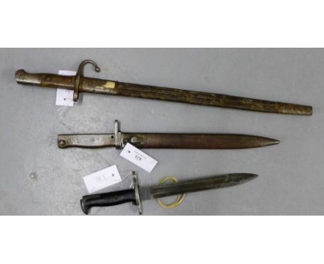 A WWII US UFH short bayonet together with a Turkish bayonet and scabbard and a German WWII bayonet and scabbard (3) 
