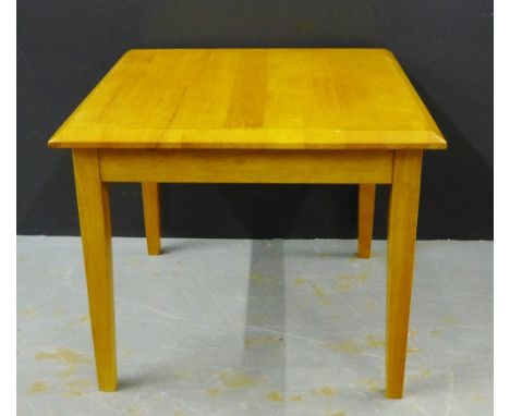 A contemporary light wood lamp table, the square top on shaped supports