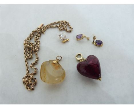 A 9ct pendant chain, 5.3g; two 9ct mounted hard stone pendants; a pair of amethyst earrings and a white stone pendant.