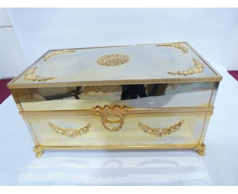 A fine Italian white metal and parcel gilt scent or Cologne casket, the interior with mirror plate to the lid, a cut glass po