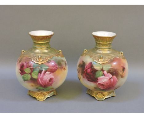 A pair of Royal Worcester globular vases, painted with roses, 16cm high