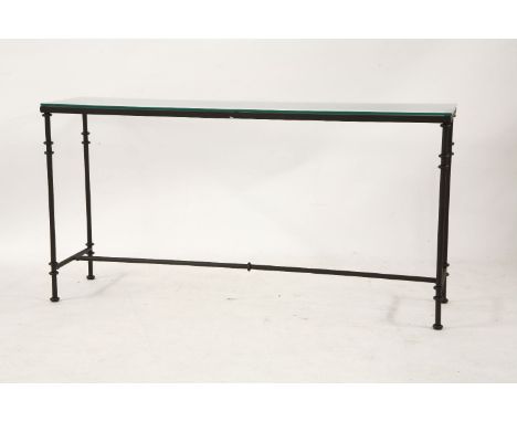 A contemporary tubular iron and glass topped console table