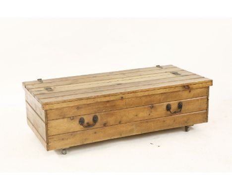 A pine trunk on wheels, with a double hinged top, 120cm