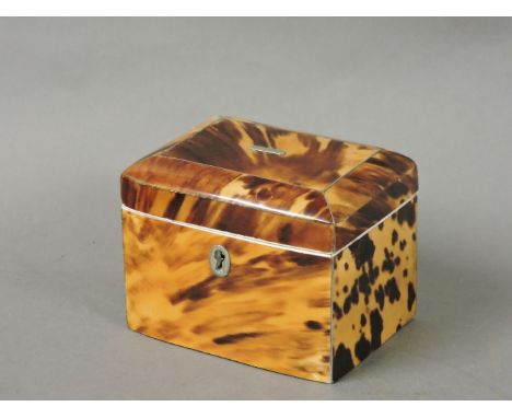 A 19th century tortoiseshell tea caddy, with a slight bow front, an internal lid, and ivory rims, lacking ball feet, 10.5cm w