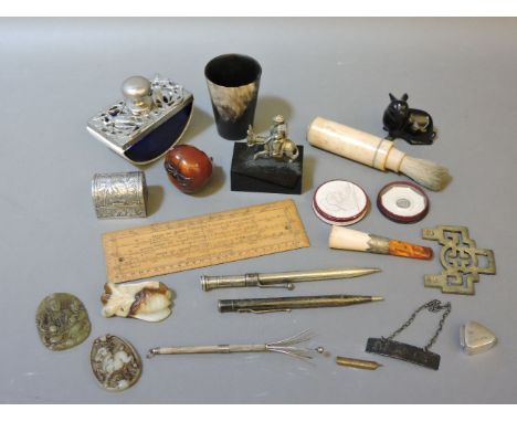 A box of miscellanea, including a miniature white metal trunk, carved jade roundels, etc