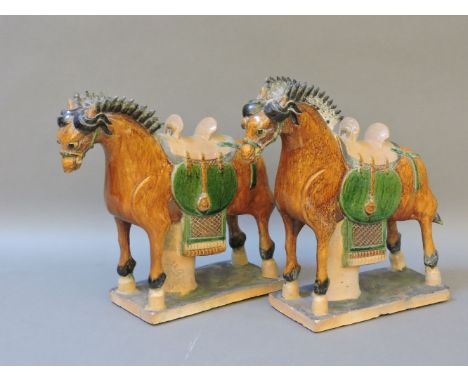 A pair of Chinese Sancai pottery horses