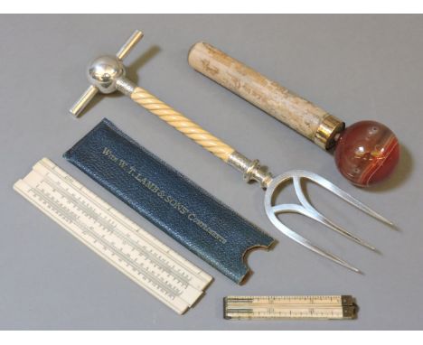 An agate parasol knop, with 18ct mount, a Rabone & Son folding ruler and slide ruler, and a Victorian silver plated bread for