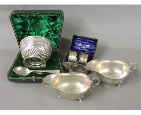 A pair of silver sauce boats, by Adie Bros, Birmingham 1923, a cased silver bowl and spoon, by JWB, Sheffield 1897, and two c