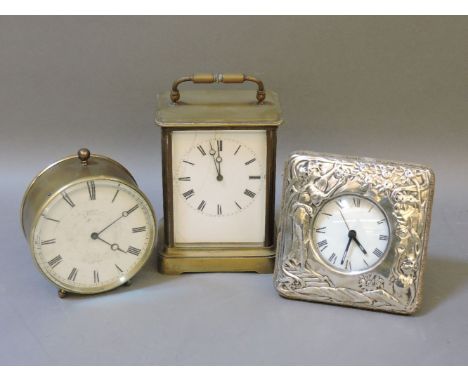 Two Edwardian brass cased mantel clocks, and a modern silver fronted clock