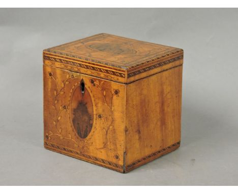 A George III satinwood inlaid tea caddy, with oval medallions and floral work, 12cm wide