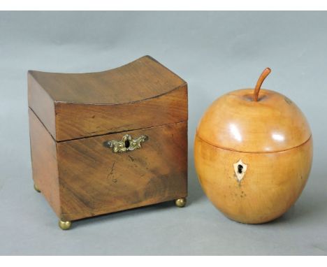 A mahogany tea caddy, with a concave top, internal liner, on brass feet, 12.5cm, and a turned apple tea caddy, 14cm