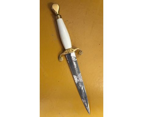 An unusual paper knife, made by Wilkinson, with an engraved tennis player