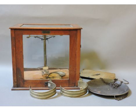 A W & J George Ltd set of cased brass scales, together with a Salter's improved circular spring balance, and a pair of Regenc