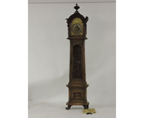 An oak longcase clock, with an arched dial and a silvered chapter ring, with damage, 240cm