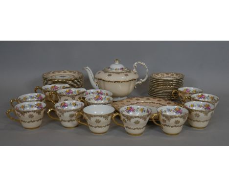 A late 19th century hand gilded and decorated Paragon tea service to include 18 plates, 10 cups with 12 saucers, sugar bowl, 