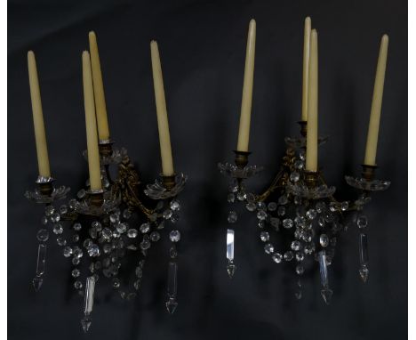 A pair of vintage gilt metal four branch wall sconces with cut crystal swags and drops. W.35cm 
