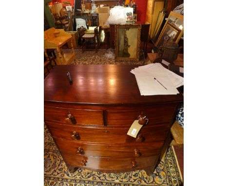 A Victorian mahogany bow fronted chest of two short over three long drawers over an apron flanked by bracket supports  